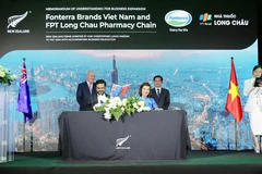 Lễ ký kết của FPT Long Châu và Fonterra Brands Việt Nam ký kết có sư chứng kiến của Thủ tướng New Zeland. (Ảnh: PV/Vietnam+)